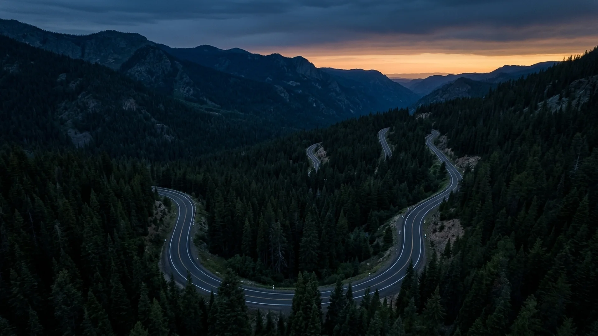 Scenic winding mountain road at sunset for RideMate